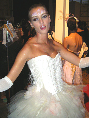 Model, Dominique, shows her talents back stage.